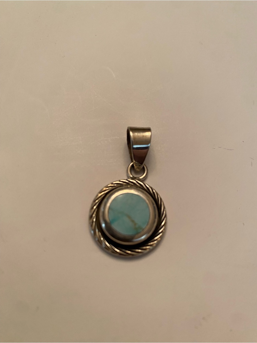 Sterling Silver Turquoise Round Pendant with rope bezel.
